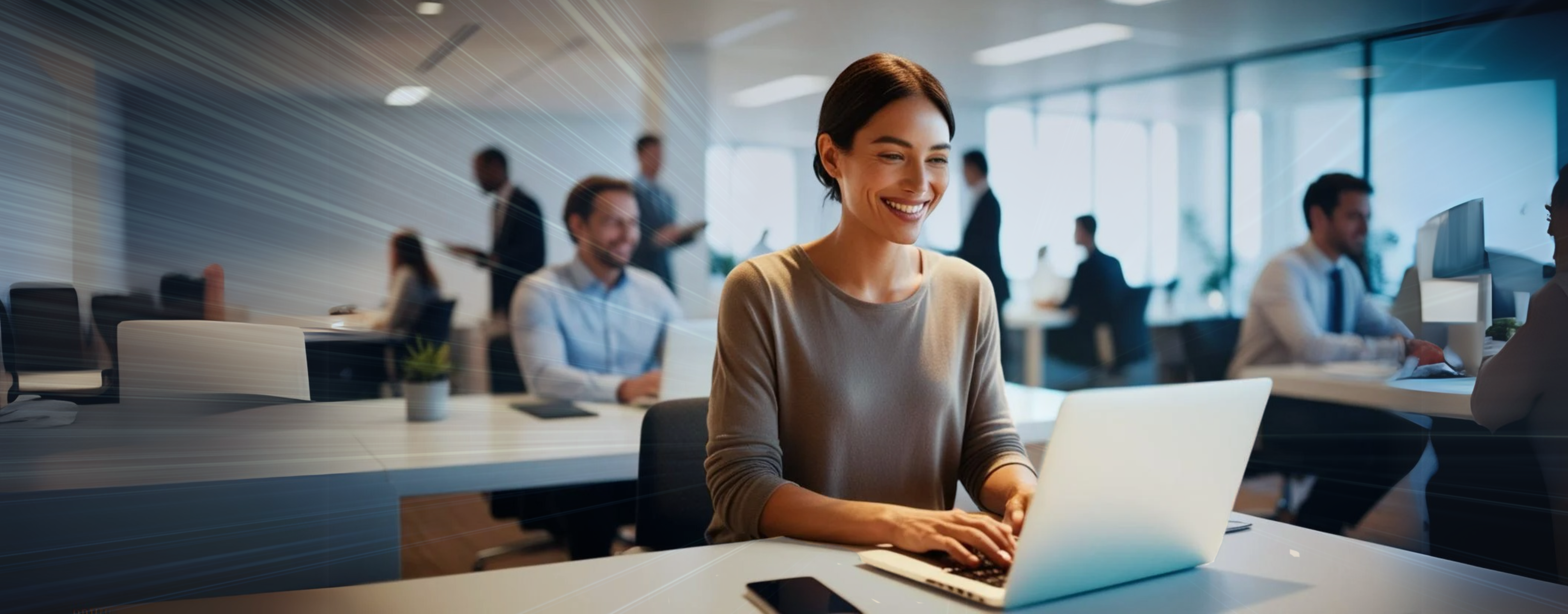 modern office worker at laptop smiling with bright lights